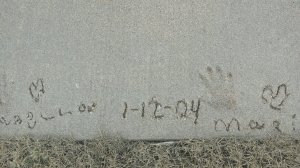 The children's handprints in front of their country home.