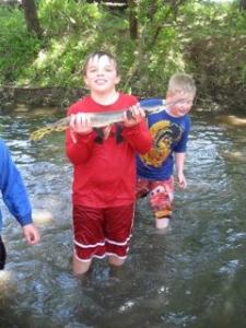 Mario, the younger child, shares his conquest with pride then sets it free (like a good boy!).
