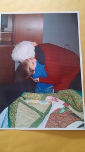 Grandma Rhetta gets a BIG hug from 5-year-old Mario for the beautiful quilt she made him.
